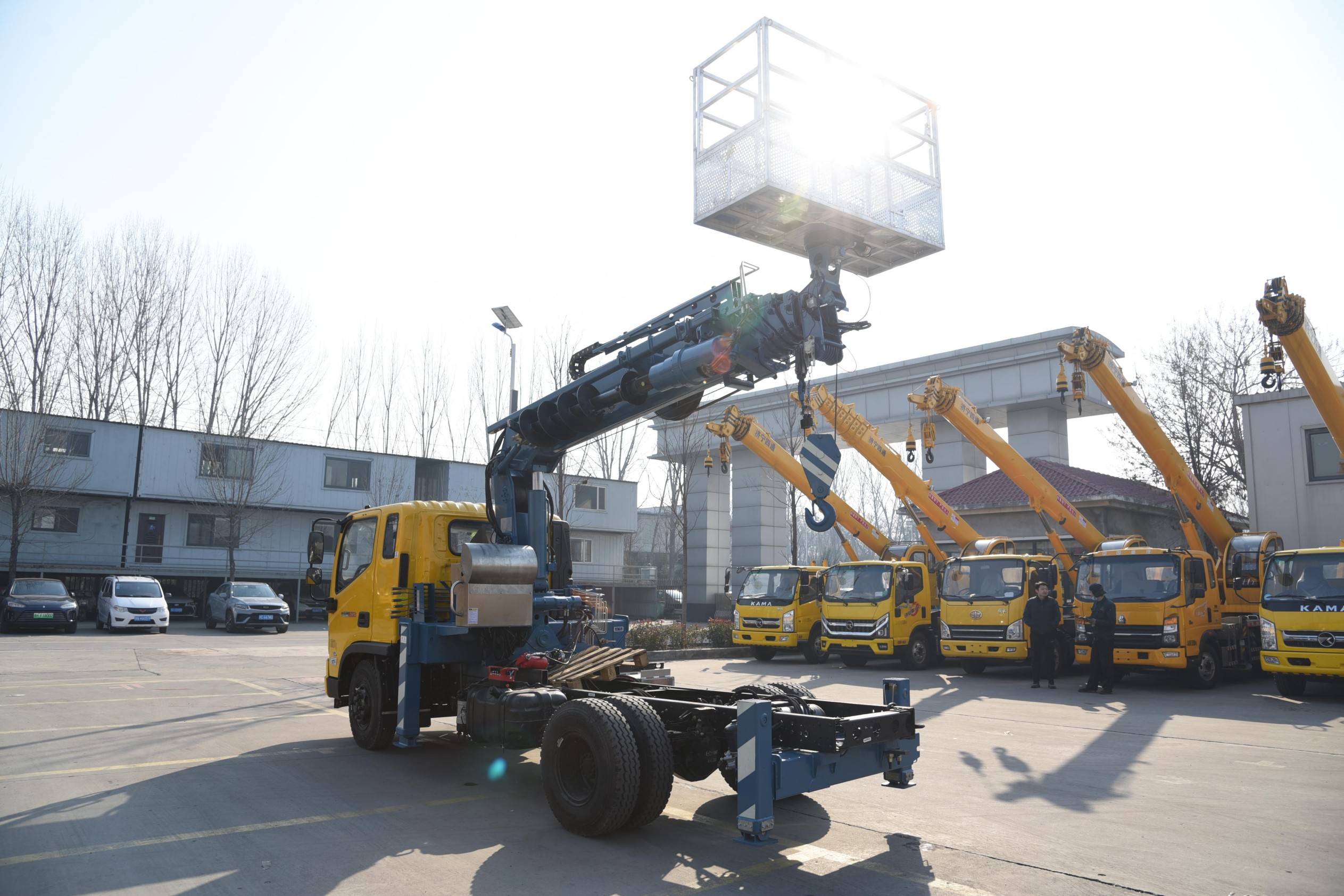 Multi-functional truck-mounted crane with drill bit