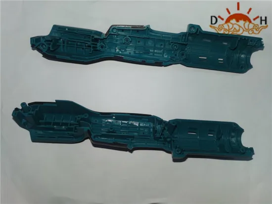 Two color plastic injection molded power tool handles