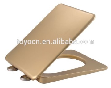 golden color square shap toilet seat cover