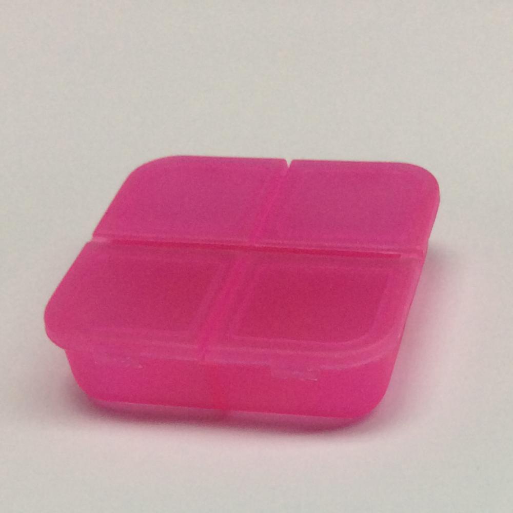 Mini caja de pastillas de plástico de cuatro rejillas portátil