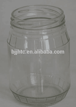 round and transparent textured glass jar