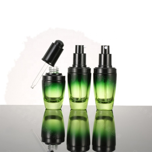 Cosméticos verdes claros redondos que galvanizam frascos da garrafa de vidro