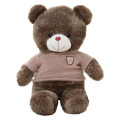 Small black bear stuffed animal with sweater