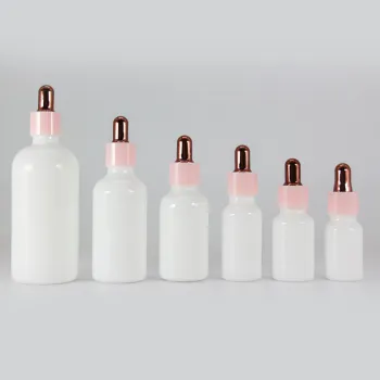 white glass cosmetic bottle with bamboo dropper