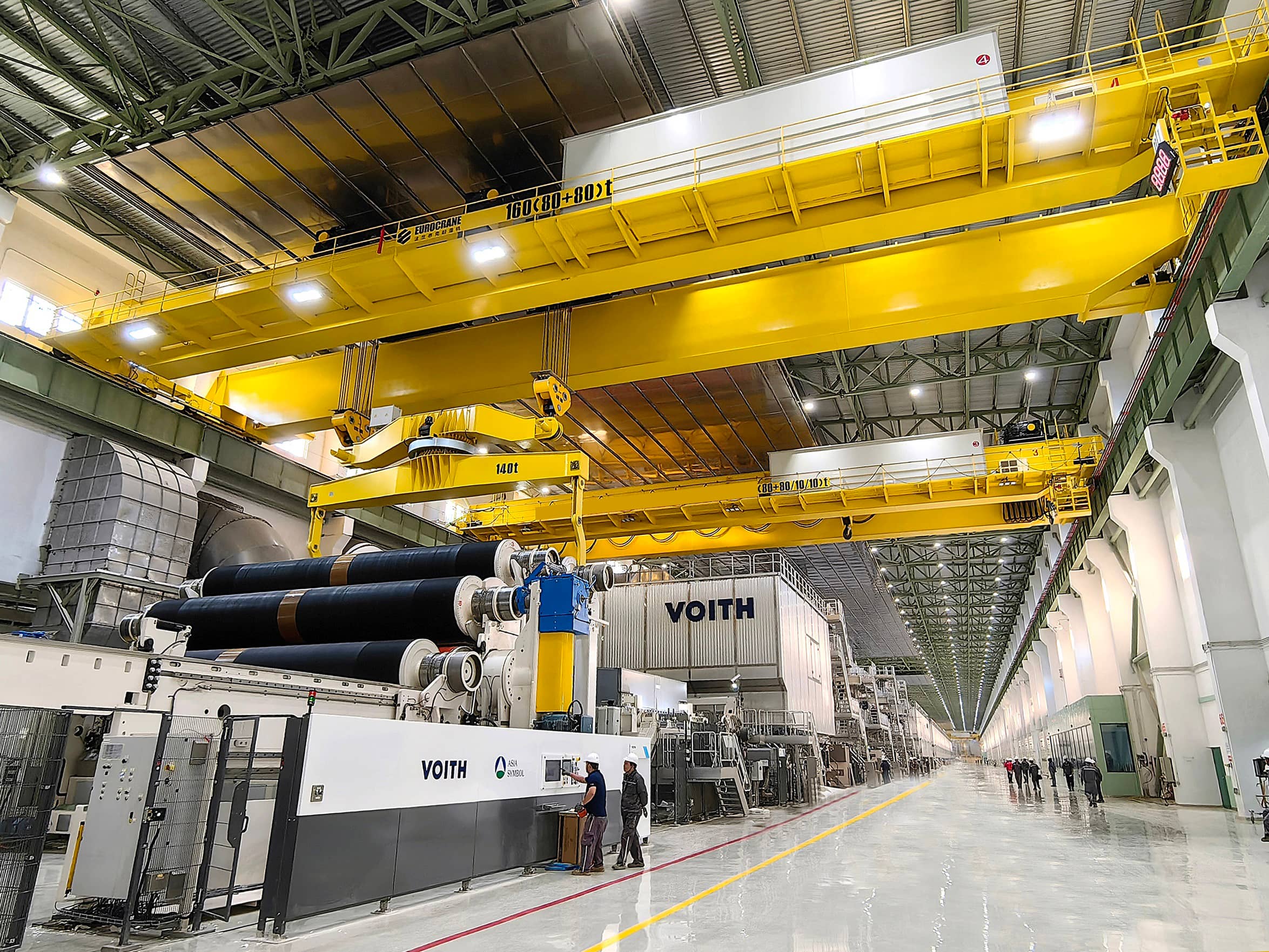 Eurocrane 160t industrial overhead crane lifting Valmet paper machine suction rolls