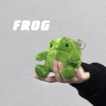 Plush little frog pendant in chubby sitting position