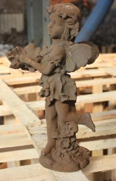 winged figures decorated with cast iron