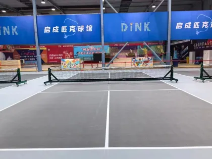 Movable pickle ball post