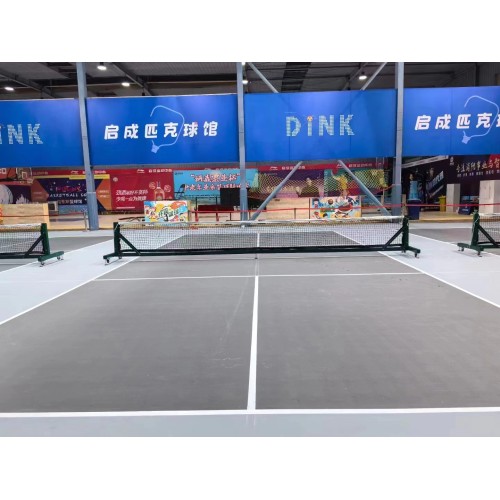 Movable pickle ball post