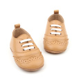 Bebé de los zapatos casuales de los niños más vendidos de alta calidad