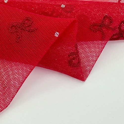 Tessuto in tulle di poliestere con fiocco glitterato in schiuma