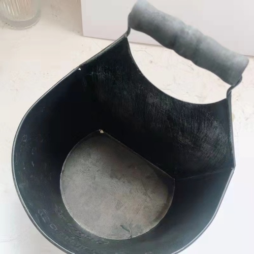 Old dark grey embossed iron drum