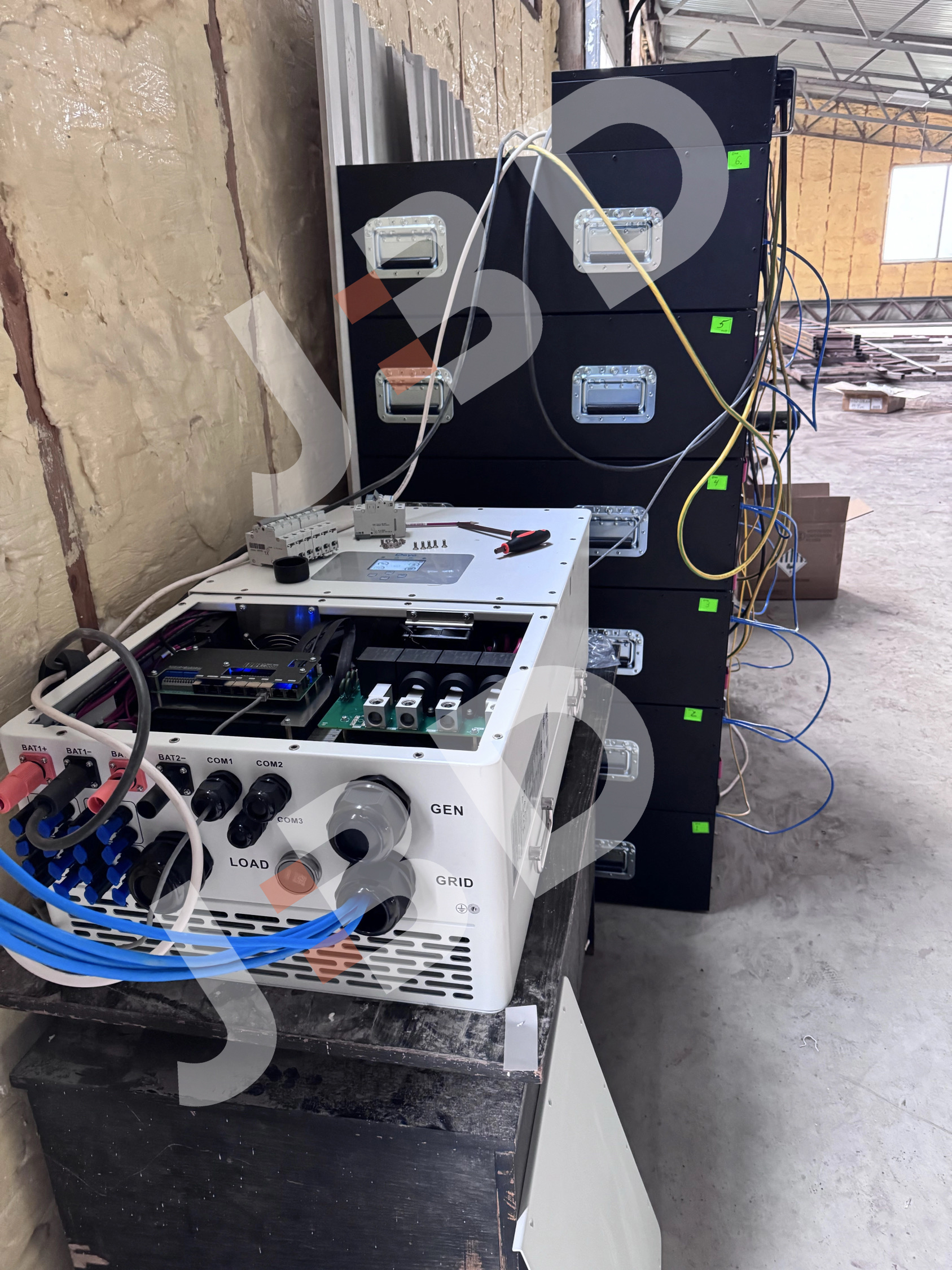 BD High Voltage Energy Storage System Installation: Open Hybrid Inverter Connected to Rack-Mounted Battery Modules in Ukrainian Factory