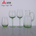 Hand blown dark green colored wine glass set