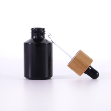 Black oblique shoulder glass dropper bottle