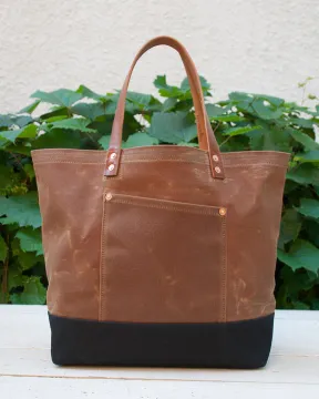 Water resistant waxed canvas tote bag with leather handle