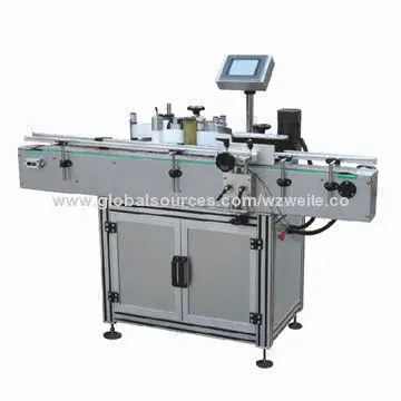Manual bottle labeler