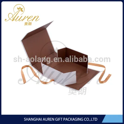 Plain white folding apparel boxes with ribbon