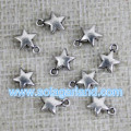 Venta por mayor 6.5MM estrella Metal plata brillante pequeños encantos colgantes