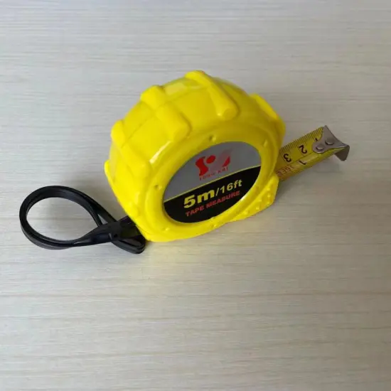 Portable steel tape with yellow plastic shell