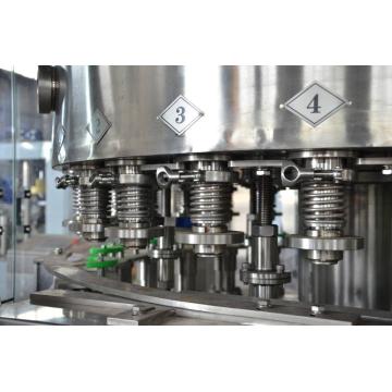 Filling and sealing machine for cans