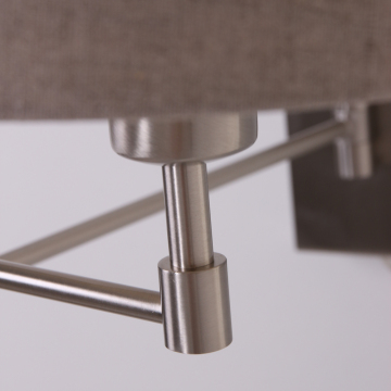 Swing arm wall lamp in fabric shade