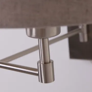 Swing arm wall lamp in fabric shade