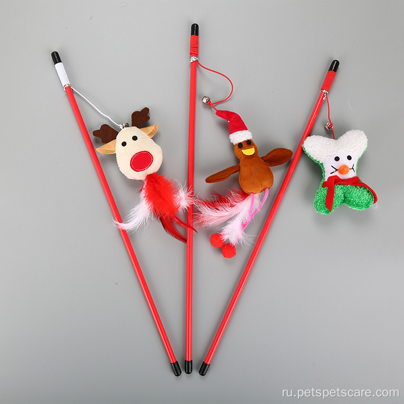 Снеговик с снеговиком в стиле Рождества играет на игрушку для кошек