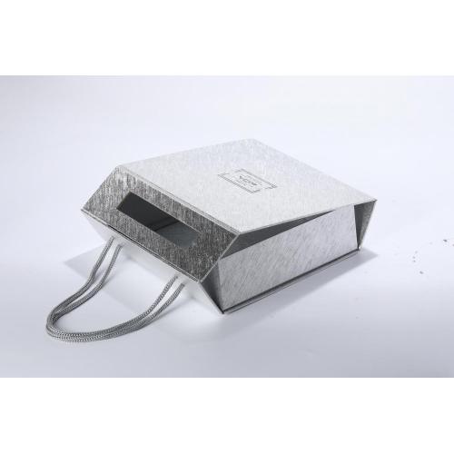 empty silver cardboard perfume package box