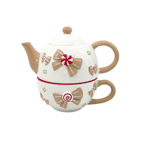 Tetera con cubiertos navideños con lazo.