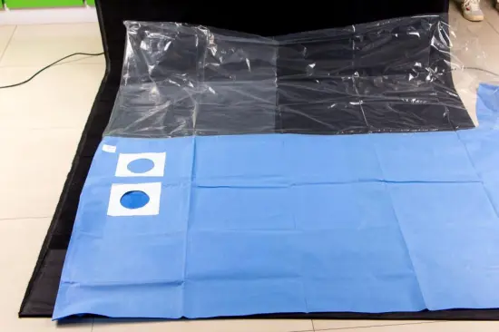 Disposable surgical drape with SM reinfored piece