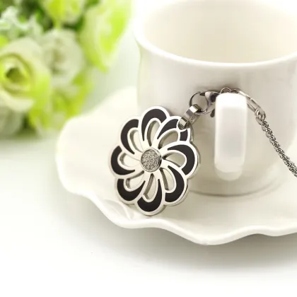 Flower pendant with black glue and crystal