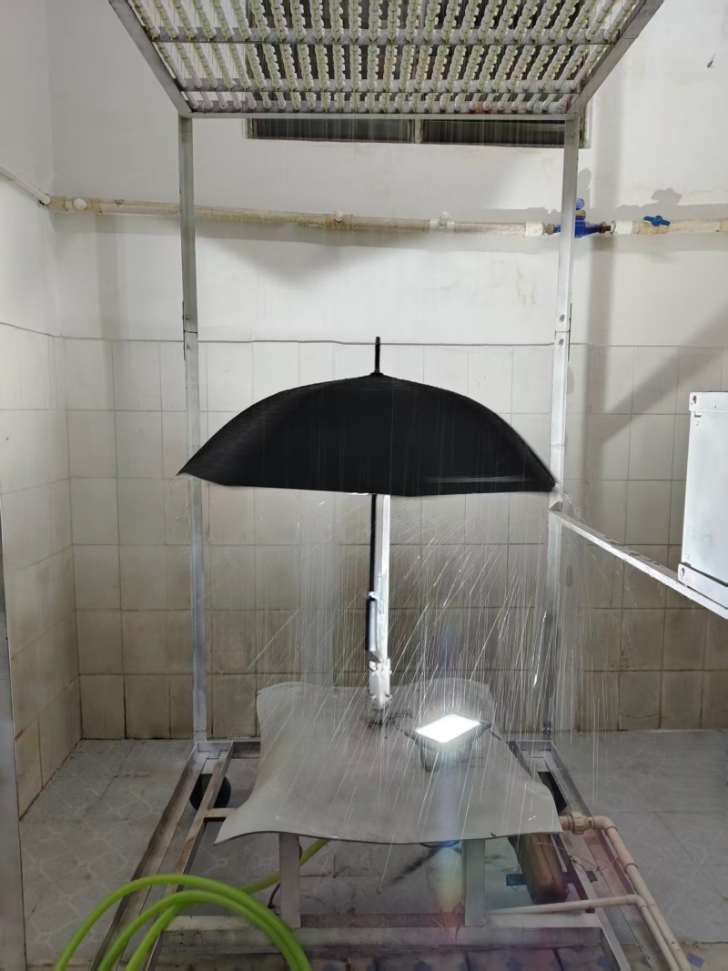 Fabric waterproof test on umbrella using lab rain simulation equipment