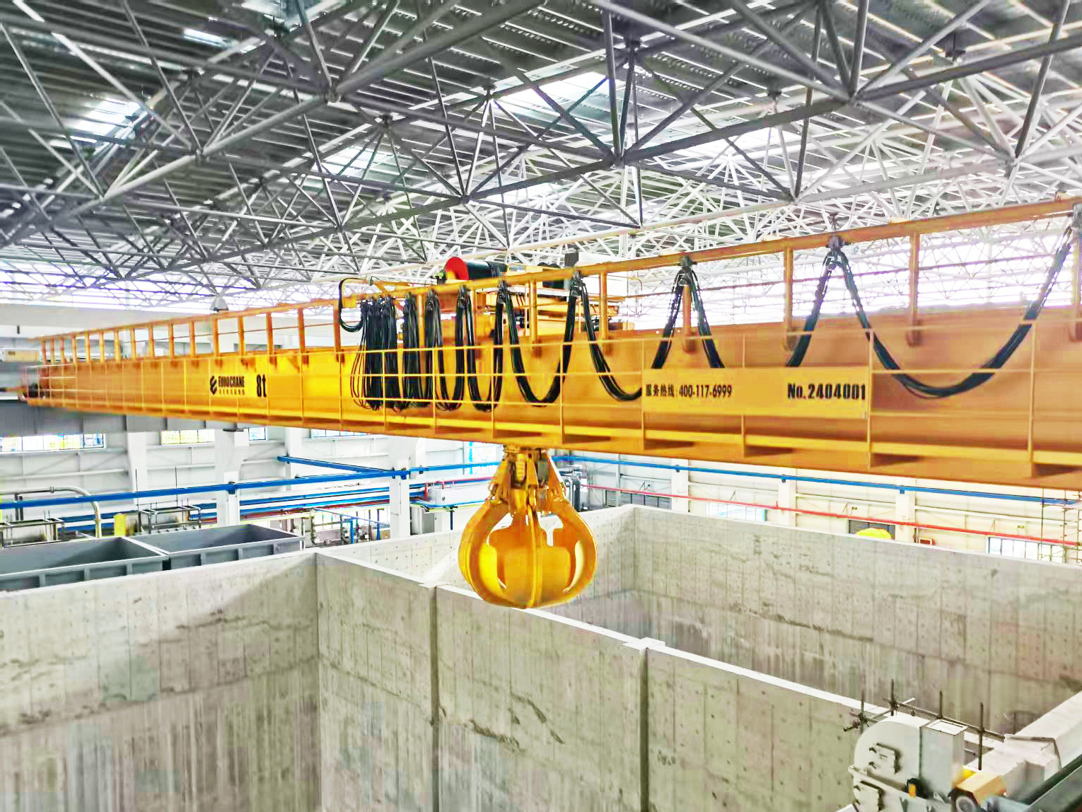 Eurocrane waste handling grab crane operating in municipal solid waste treatment plant