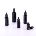 Black round shoulder bottle with tamper evident dropper