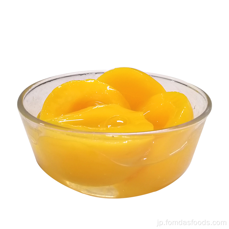 A10缶詰の黄色の桃の半分は重いシロップです