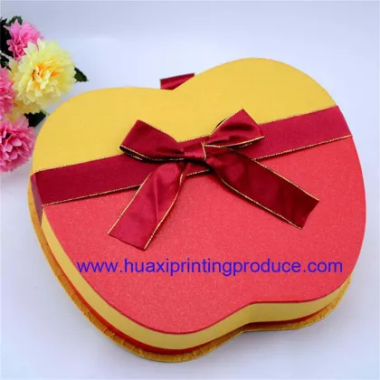 red and yellow apple shaped chocolate boxes