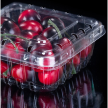 Caja de empaquetado de frutas con tapa abatible con hebilla