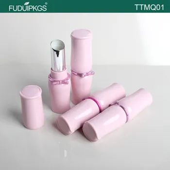 Pink empty lipstick tube with fancy butterfly