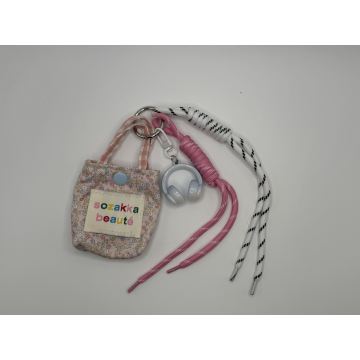 Lindo llavero de felpa con mini bolso de flores, dije portátil