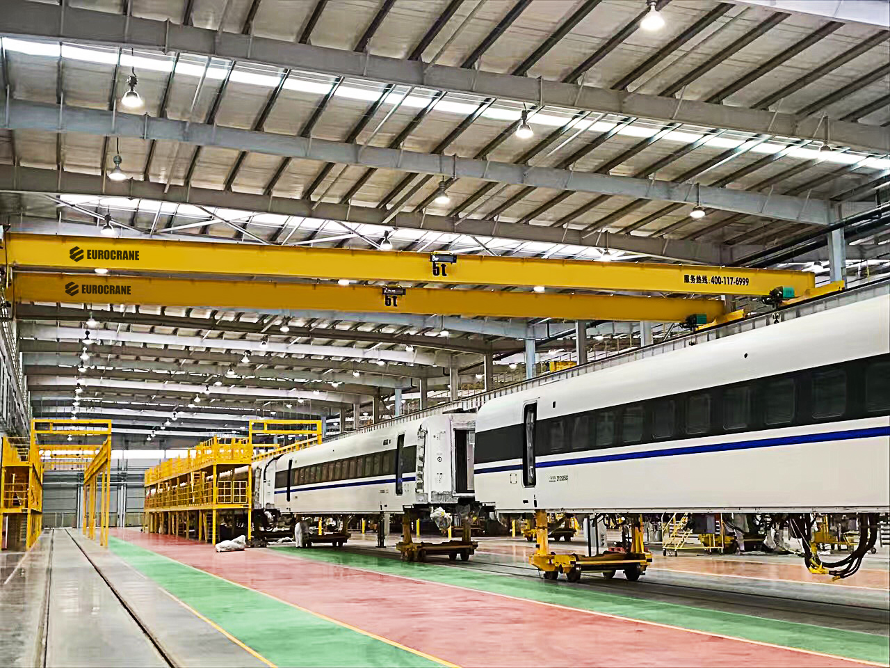Eurocrane double girder overhead crane lifting train body in railway vehicle assembly workshop