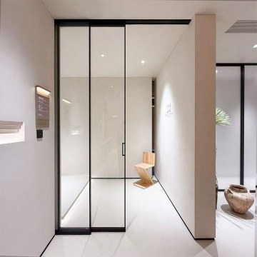 Puerta corrediza minimalista de aluminio sin rieles