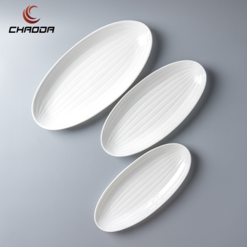 Wholesale Bone China White Oval Fish Plate Embossed Ceramic Restaurant Dish