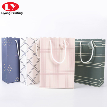 Solid color carrier portable paper bag with wavy