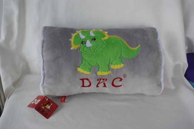 Embroidered dinosaur cushion