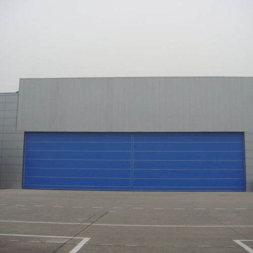 Fast action high speed tacking up hangar door
