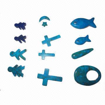 Compressed turquoise beads and cabs in carved animal/cross shapes, various styles are available