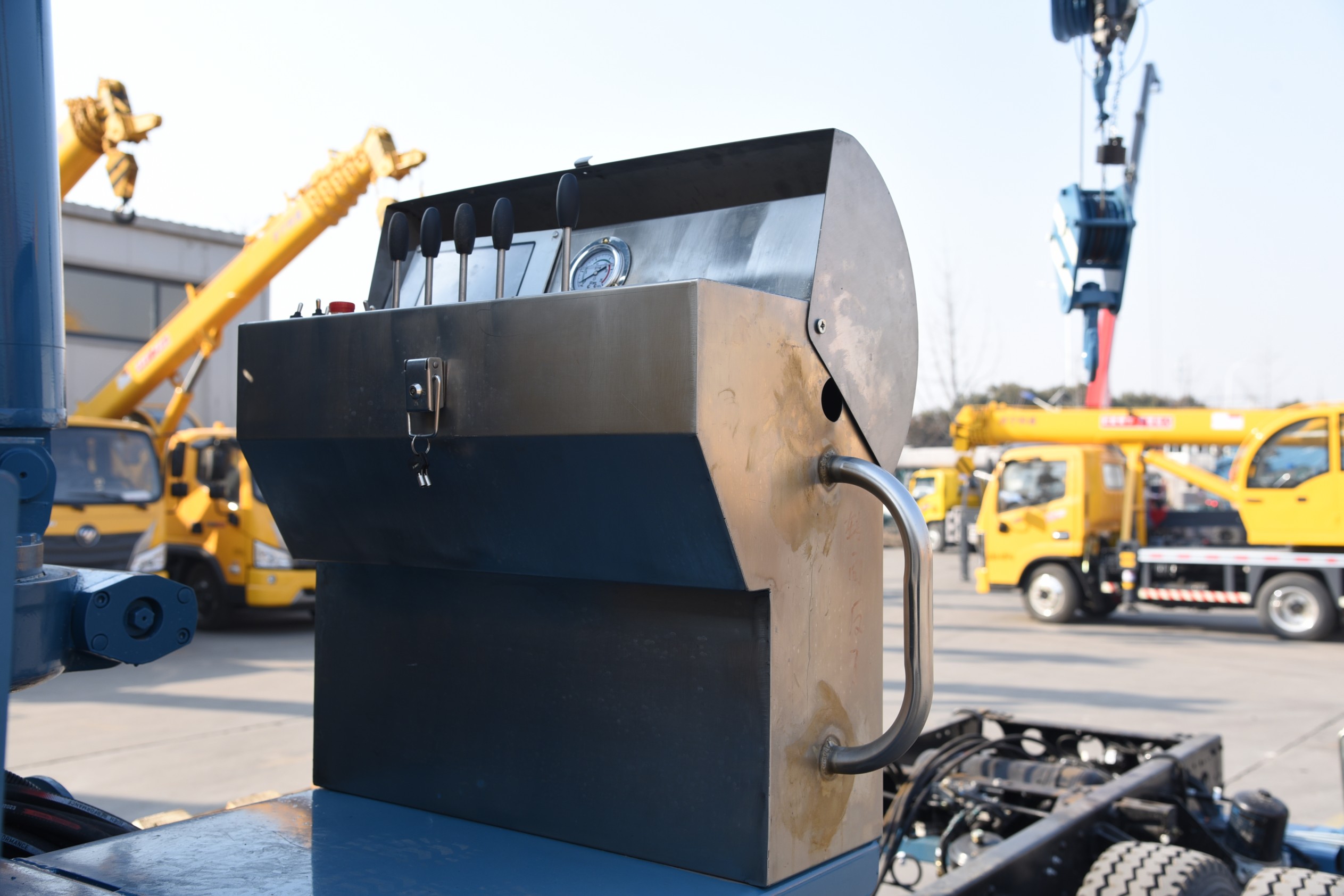 Multi-functional truck-mounted crane with drill bit