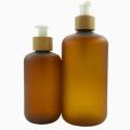 Amber frosted plastic lotion bottle with bamboo lid