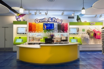 Kids store interior display solutions with toys wooden display shelves and curved checkout counters